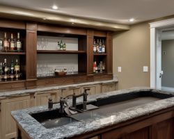 Finished basement living room with modern furniture and lighting